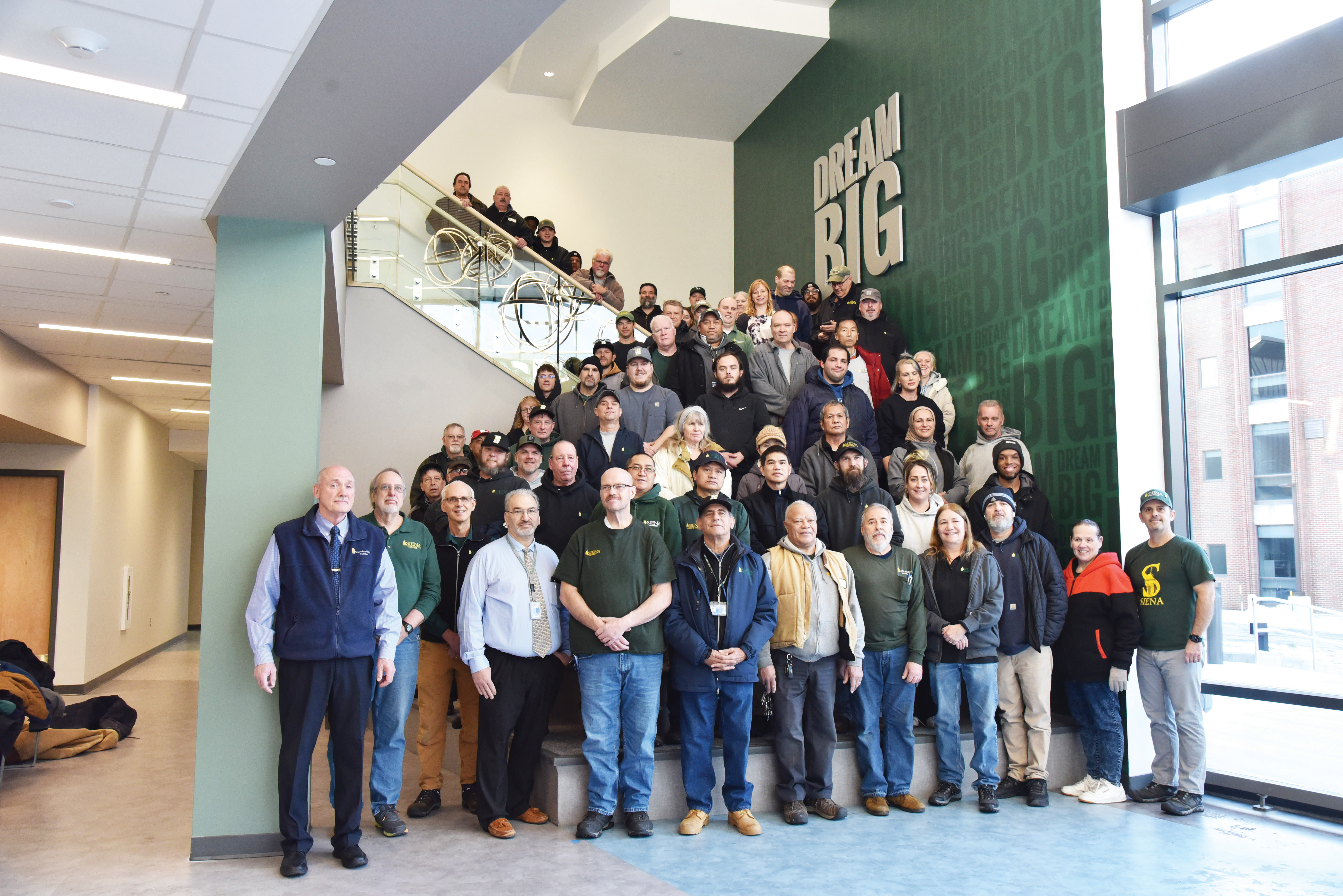Facilities staff on stairs in Nobel Hall