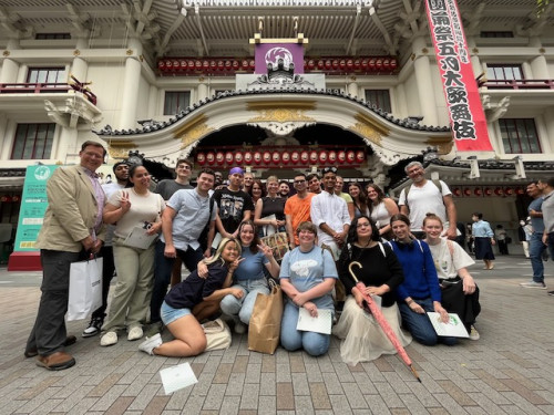 Cooper with students in Japan
