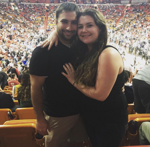 Sarah with her husband at a Miami Heat game