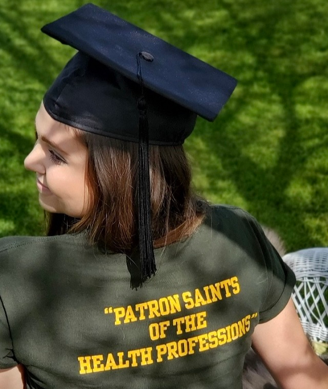 nicole in a cap and gown