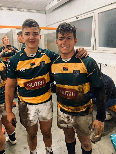 Rupert dressed in his ruby kit with a friend